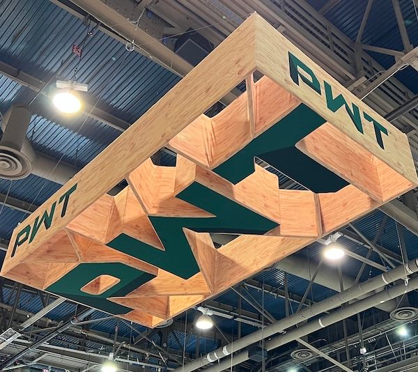 A PWT logo built of their products suspended from a cieling.